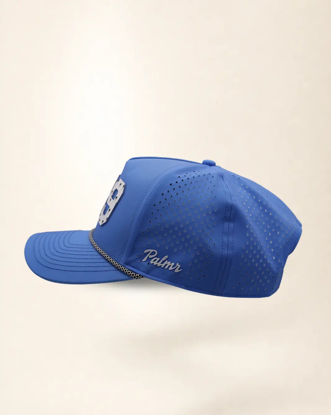 The 239 Signature Hat (Blue), left side view: white Palmr script, perforated side panel, black and white rope, edge of the white 239.