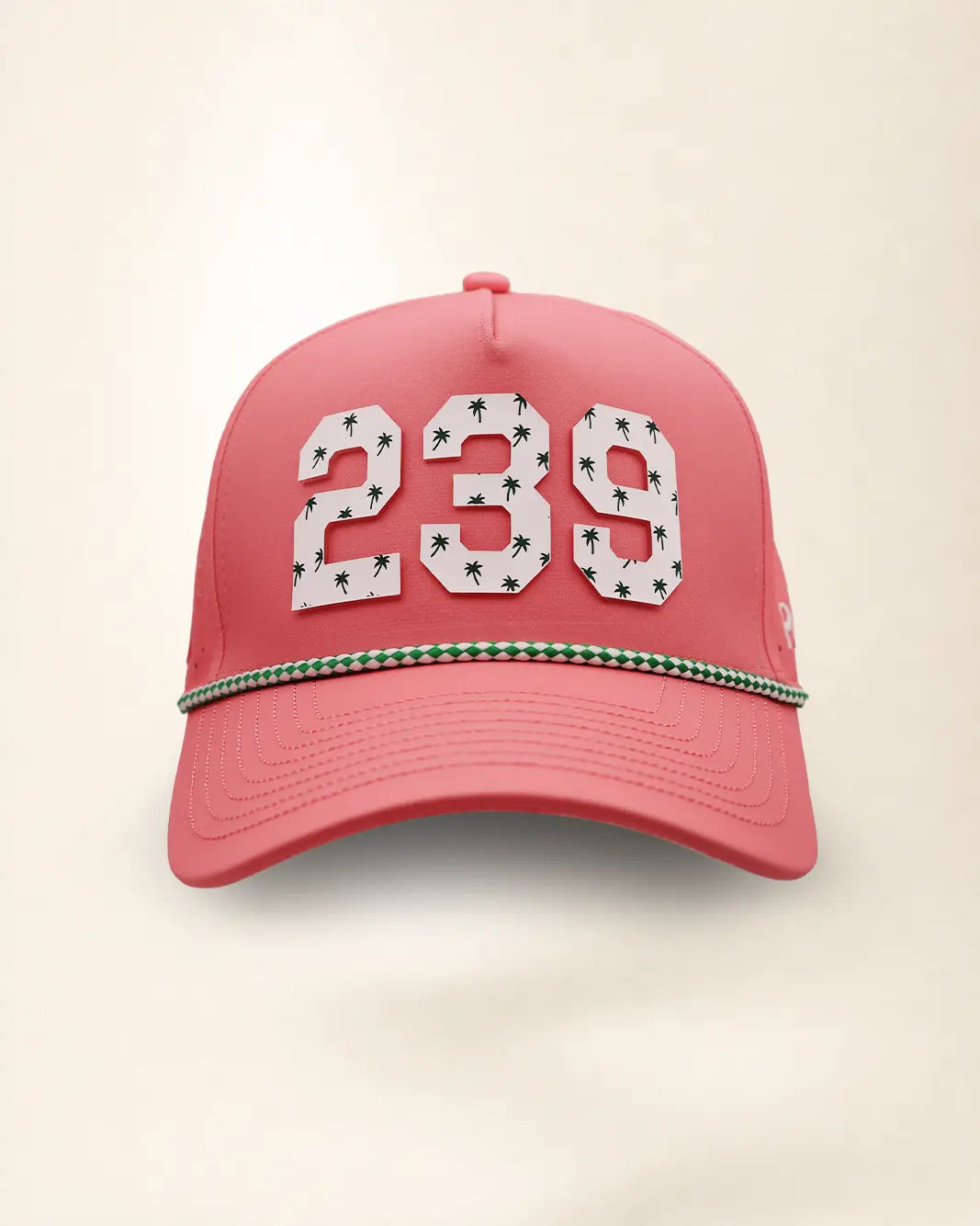 A pink perforated baseball cap showcasing the '239' State with a green and white patterned trim along the brim and white 'Palmr' script embroidery on the side, shown against a light beige background.