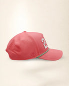 A pink perforated baseball cap showcasing the '239' State with a green and white patterned trim along the brim and white 'Palmr' script embroidery on the side, shown against a light beige background.