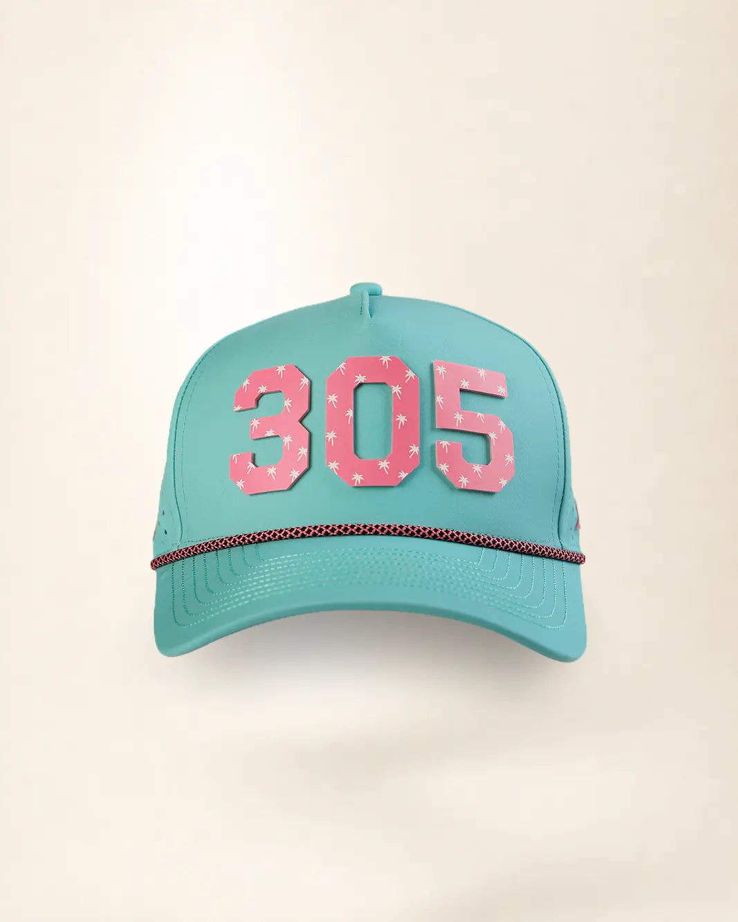 A turquoise baseball cap featuring the number '305' in pink with white polka dots on the front, and a thin red and white checkered rope detail across the brim, set against a plain cream background.