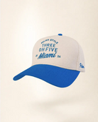 A structured baseball cap with an off-white crown and a royal blue curved brim. The front of the cap features blue embroidered text reading 'PALMIR STYLE THREE OH FIVE Miami 24', and a small blue 'Palm' logo is embroidered on the side.