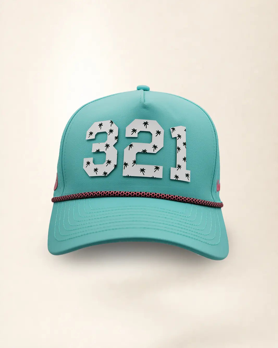 A teal baseball cap featuring the number '321' in white varsity-style lettering with palm patterns on the front, a thin white and pink chain detail across the visor, and 'Palmr' embroidered in pink on the side, set against a plain off-white background.