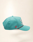 A teal baseball cap featuring the number '321' in white varsity-style lettering with palm patterns on the front, a thin white and pink chain detail across the visor, and 'Palmr' embroidered in pink on the side, set against a plain off-white background.