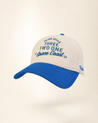 A baseball cap with a white crown and a bright blue curved brim, featuring blue embroidered text on the front and side.