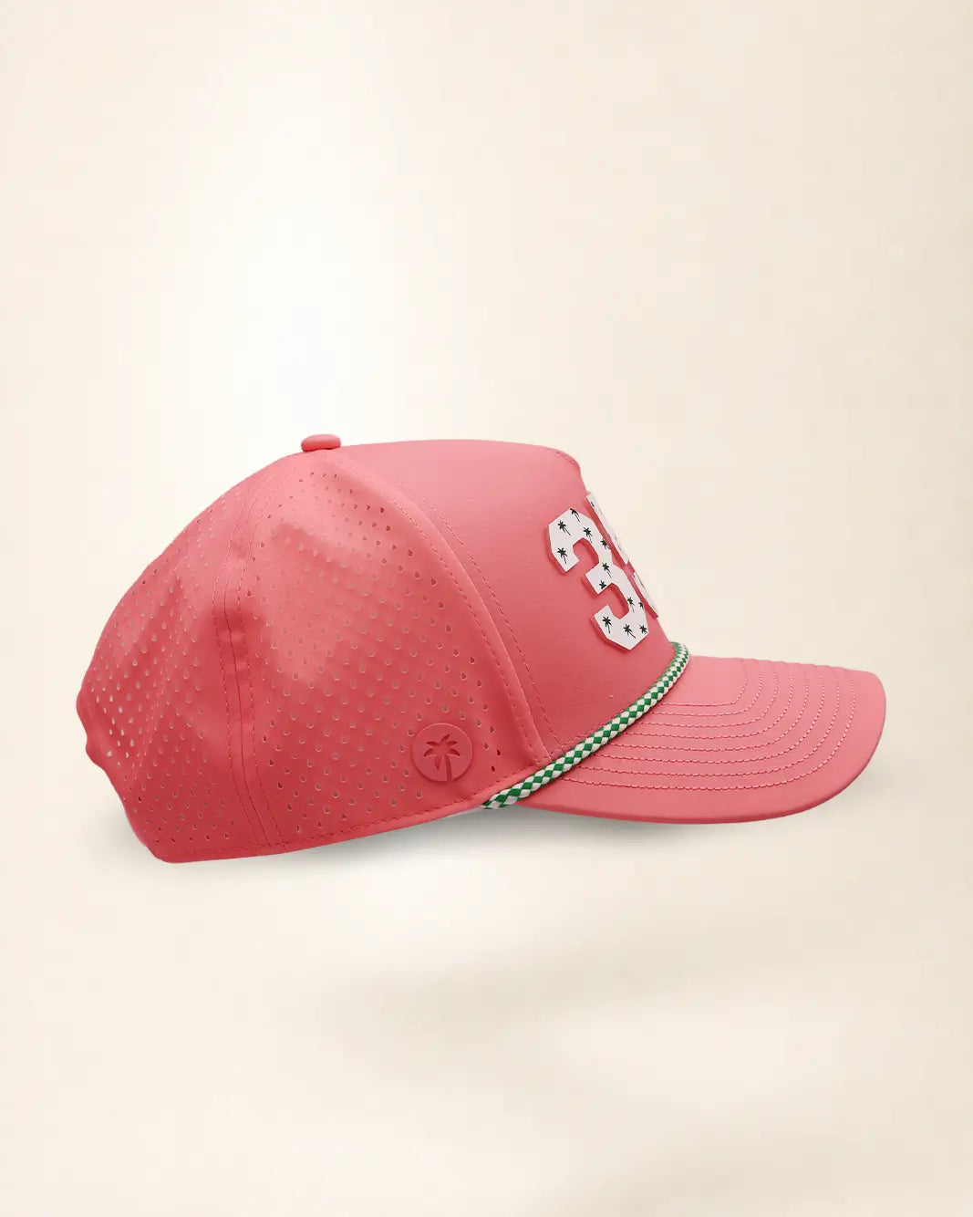 The 352 Signature Hat (Pink), right side view: perforated side panel, palm badge, green and white rope, edge of the white 352.