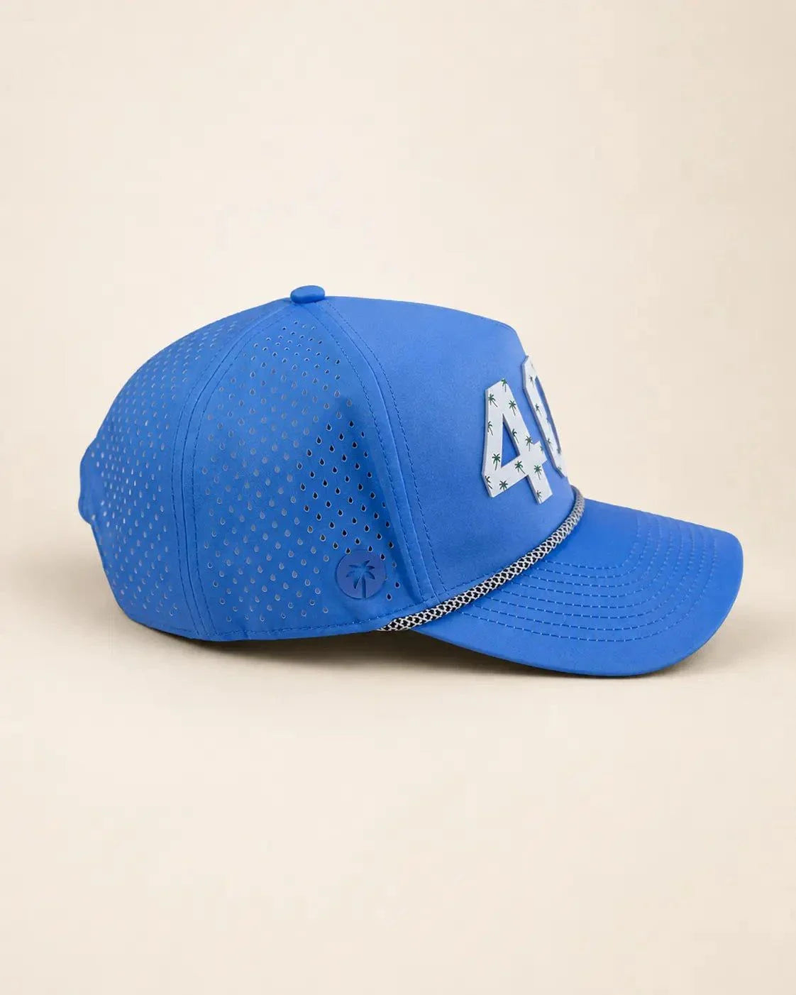 Blue 407 Hat with white silicone area code and palm design, water-resistant and breathable for boating days in Orlando