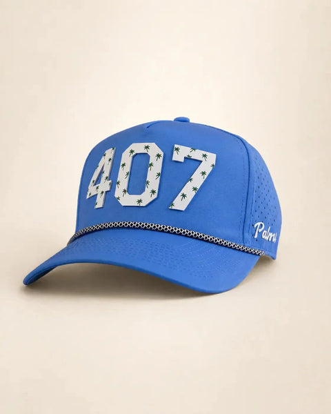 The 407 Signature Hat (Blue): blue rope snapback with 407 in white palm-print letters, navy-and-white braided rope on the brim, perforated sides.