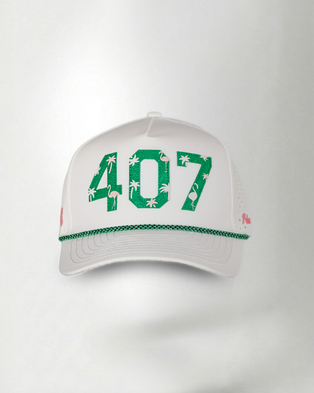White cap with green '407' and floral design on a light gray background
