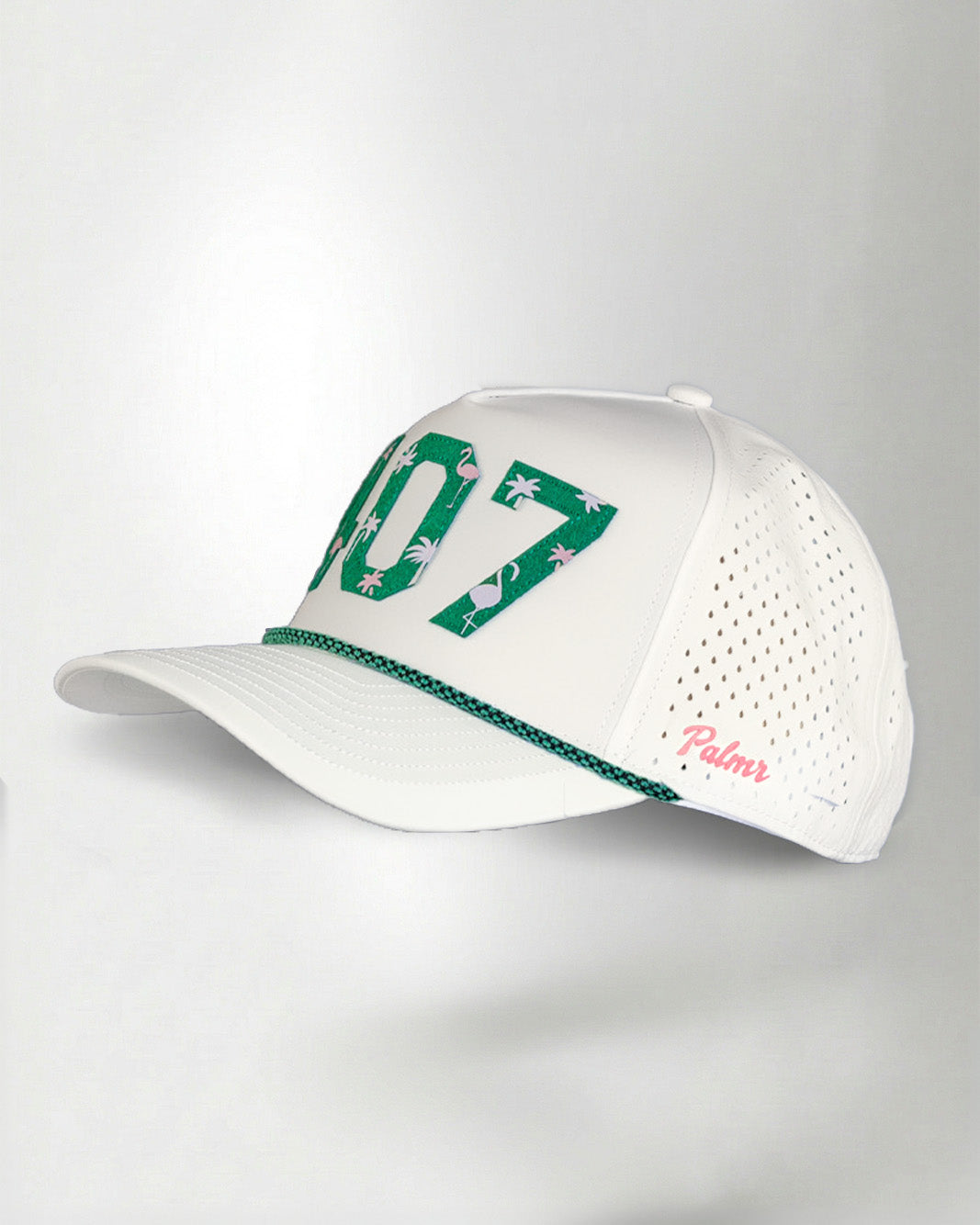 White cap with green and pink details on a light gray background