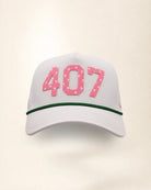 The 407 Signature Hat (Pink on white): white rope snapback with 407 in pink palm-print letters, pink rope, perforated sides, pink Palmr script.