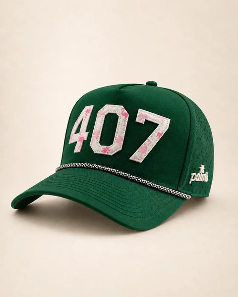The 407 Hat (Green) - Classic: dark green rope snapback with 407 in cream flamingo-print letters, black-and-white rope on the brim, perforated sides.