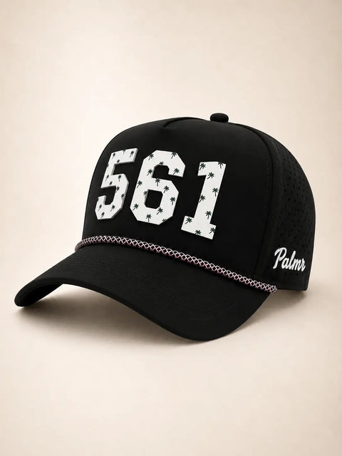 The 561 Signature Hat (Black): black rope snapback with 561 in white palm-print letters, pink and white rope, perforated sides, Palmr script.