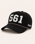Black cap with '561' and 'Palmer' text on a light beige background