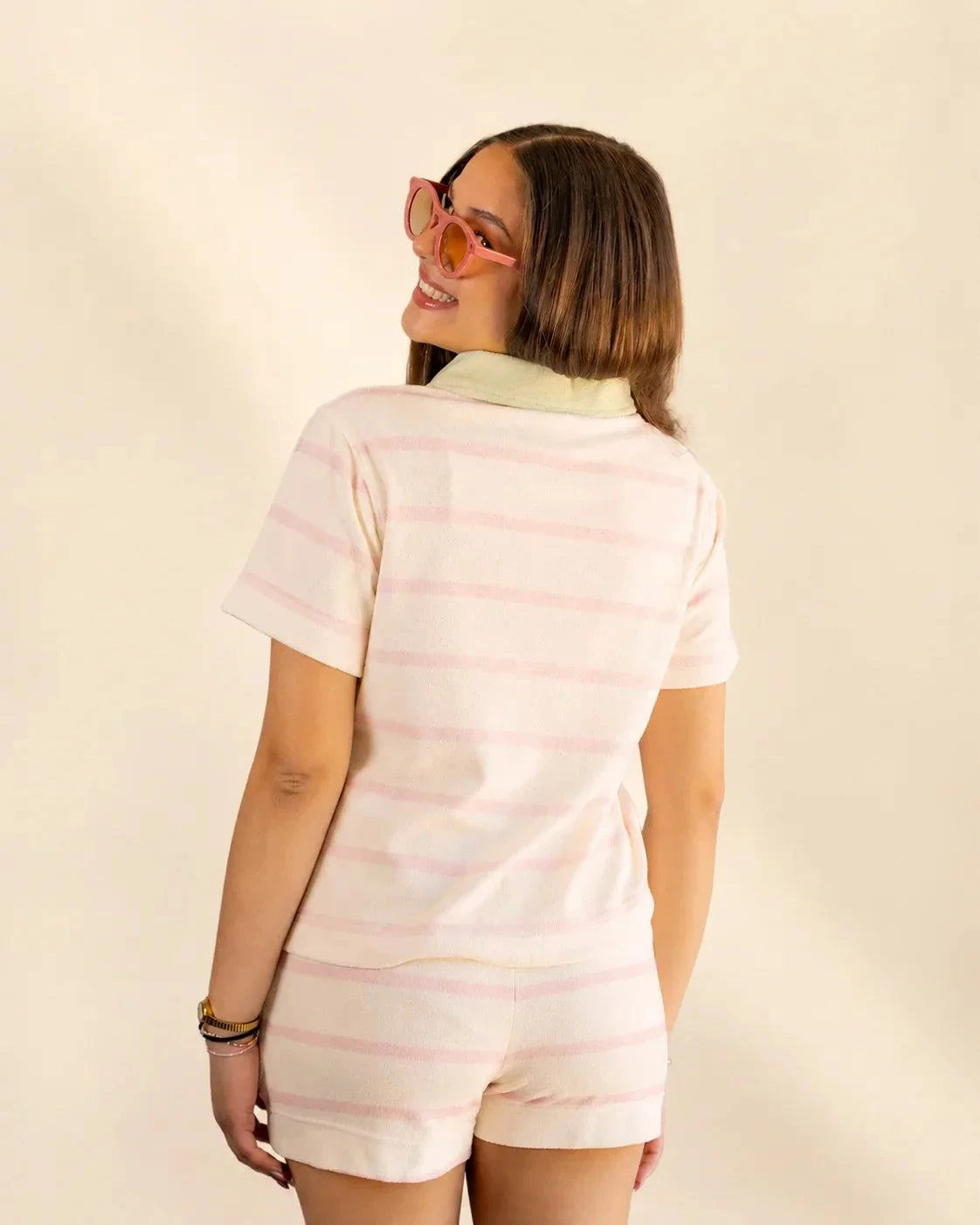The Cabana Pink Stripe Top in cream with soft pink stripes and a Palm Green collar, made from soft micro-terry cloth for a relaxed fit.