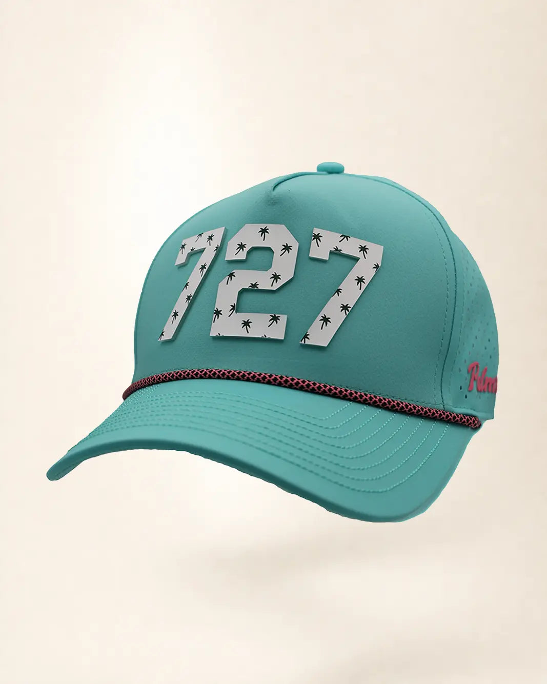 The 727 Signature Hat (Teal), three-quarter view: white raised 727 with small palm print on a teal rope snapback, pink and black rope, pink Palmr script.