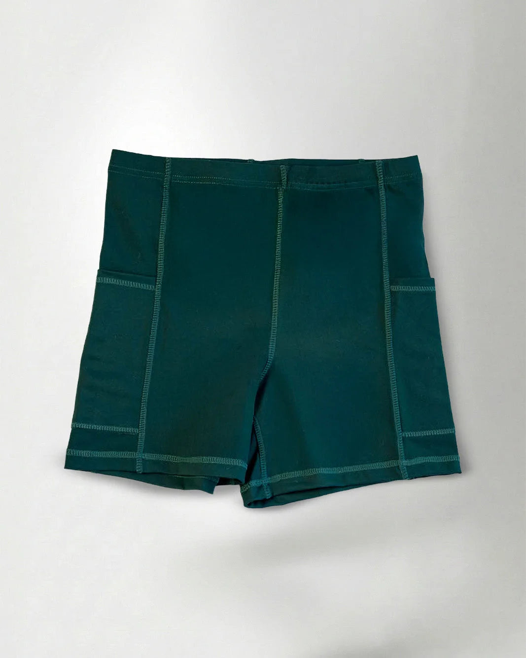 Green short against a gray background