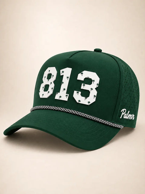 The 813 Signature Hat (Green): dark green rope snapback with 813 in white palm-print letters, black-and-white rope on the brim, perforated sides.