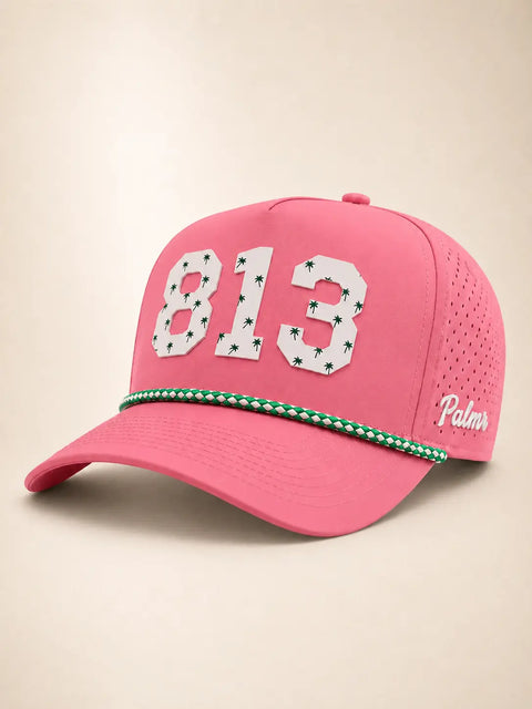 The 813 Signature Hat (Pink): pink rope snapback with 813 in white palm-print letters, green and white rope on the brim, Palmr script on the side.