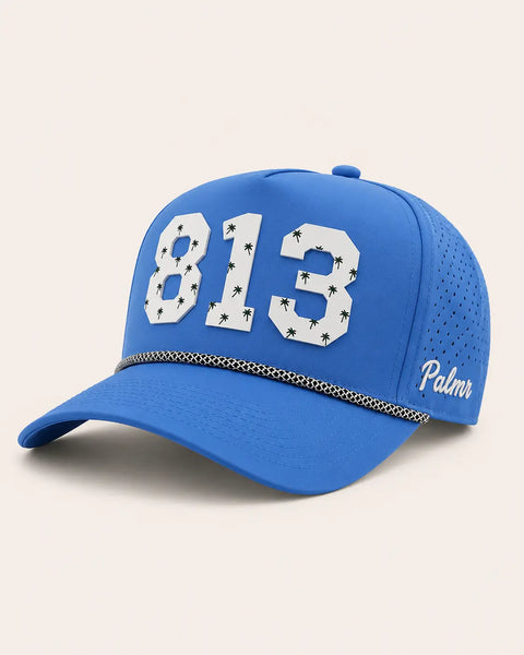 The 813 Signature Hat (Blue): royal blue rope snapback, white 813 with small green palm trees, black and white braided rope, perforated sides.