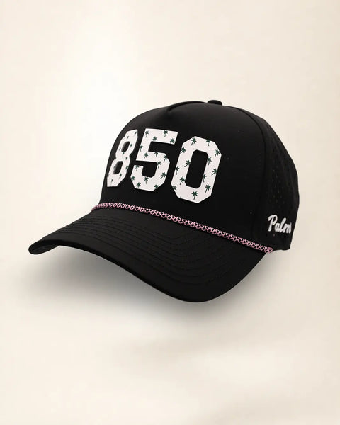 The 850 Signature Hat (Black), three-quarter view: white raised 850 with small palm print on a black rope snapback, pink and white rope, white Palmr script.