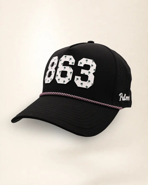 The 863 Signature Hat (Black), three-quarter view: white raised 863 with small palm print on a black rope snapback, pink and white rope, white Palmr script.