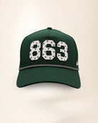 The 863 Signature Hat (Green): dark green rope snapback, white 863 with small green palm trees, black and white braided rope, perforated sides.