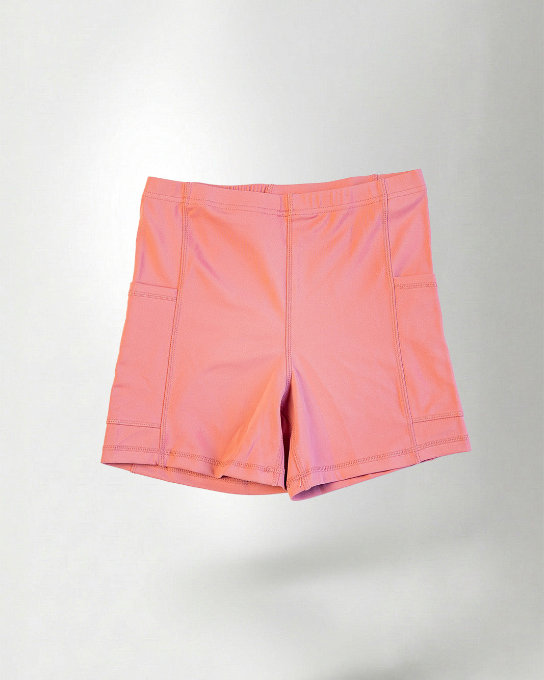 Pink short against white background 