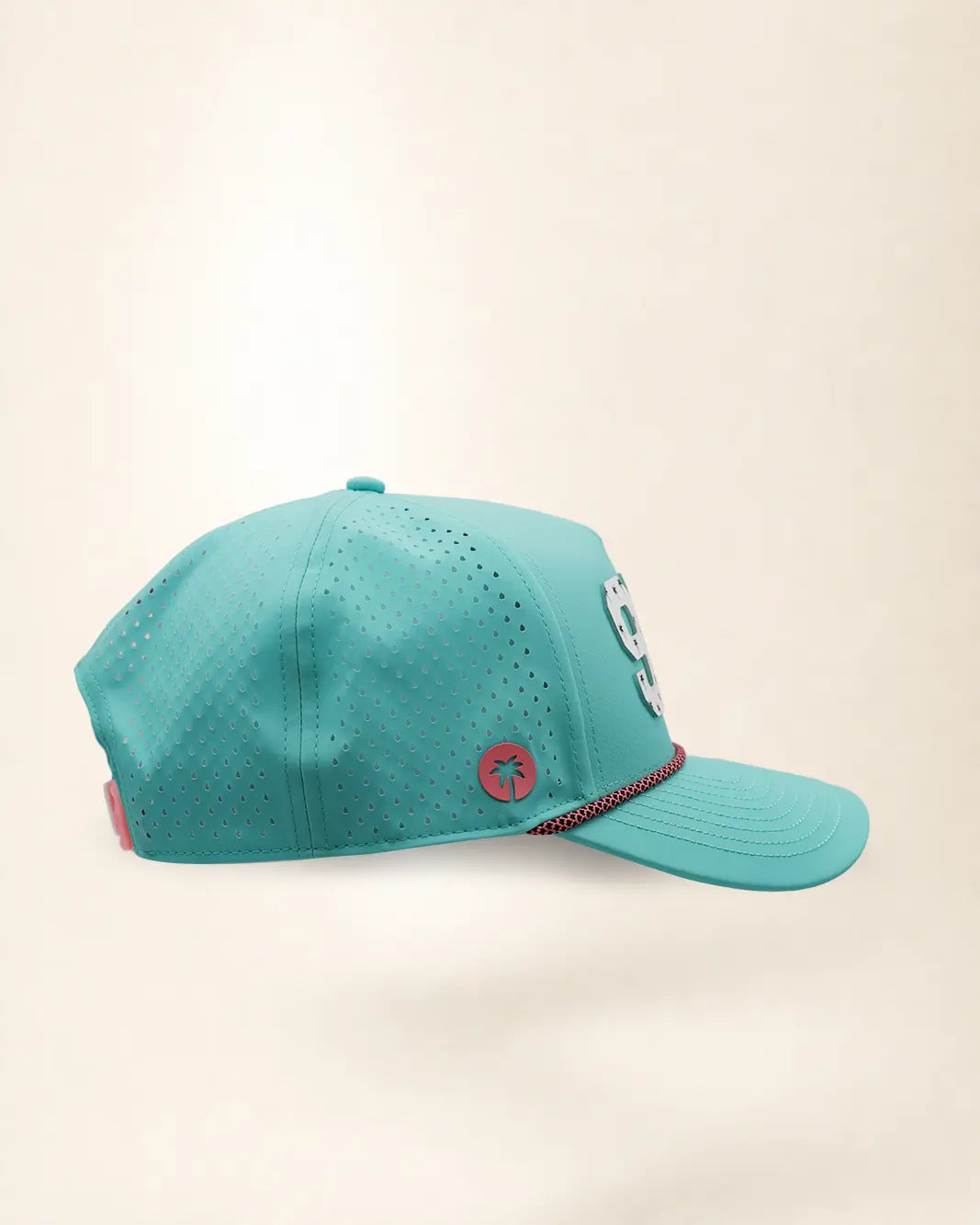 The 904 Signature Hat (Teal), right side view: perforated side panel, pink palm badge, pink and black rope on the brim, edge of the white 904.
