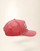 A pink perforated baseball cap showcasing the '941' with a green and white patterned trim along the brim and white 'Palmr' script embroidery on the side, shown against a light beige background.
