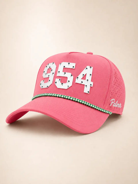 The 954 Signature Hat (Pink): pink rope snapback with 954 in white palm-print letters, green-and-white braided rope on the brim, perforated sides.