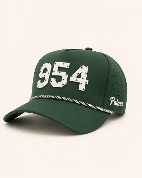 The 954 Signature Hat (Green): dark green rope snapback with 954 in white palm-print letters, perforated sides, Palmr script logo.