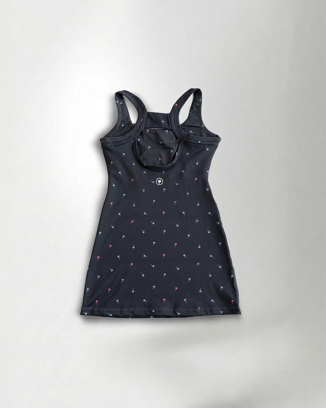 Black tank top with small white floral patterns on a light gray background