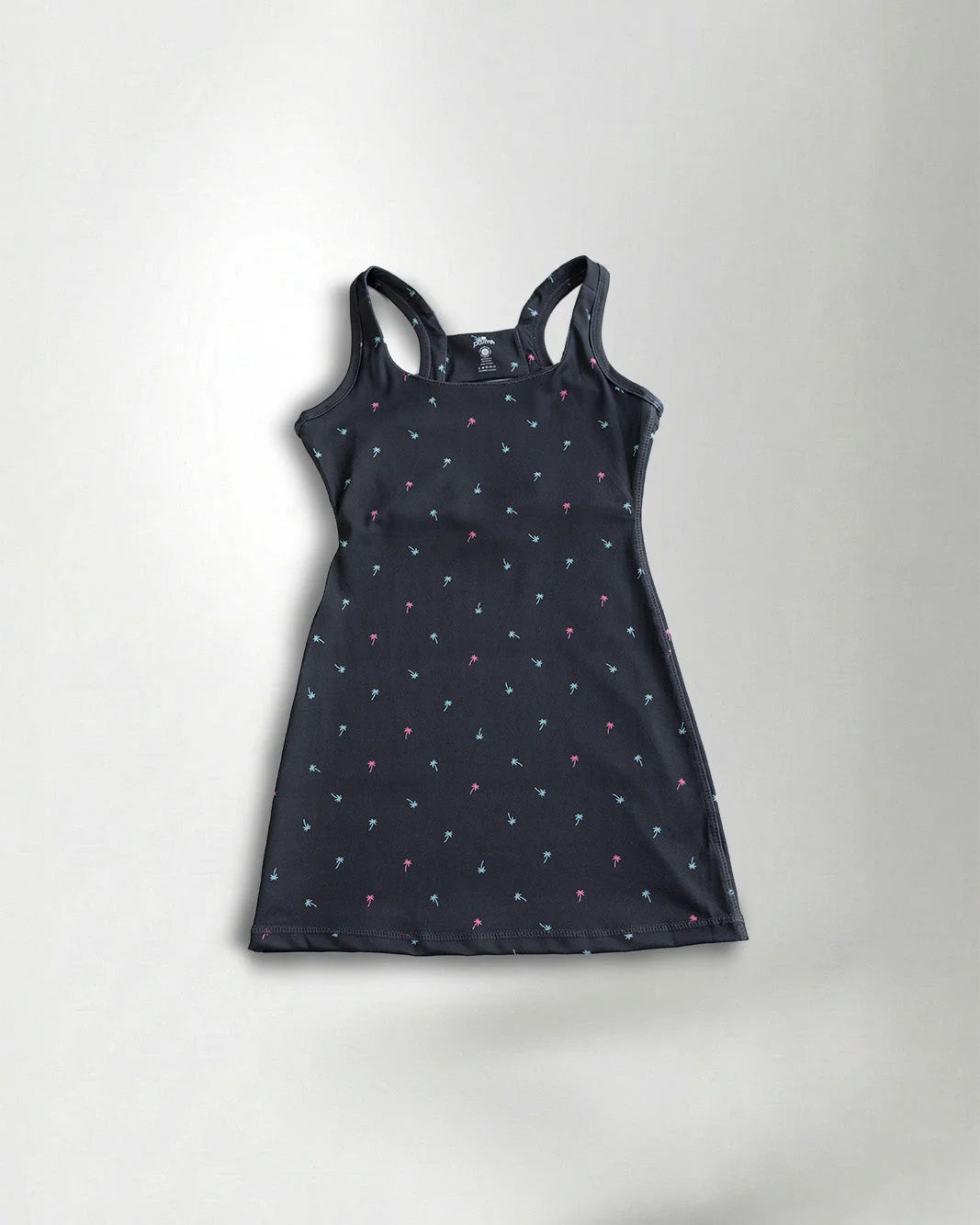 Black dress with small white floral pattern on a light gray background
