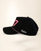 black baseball cap on a light gray background
