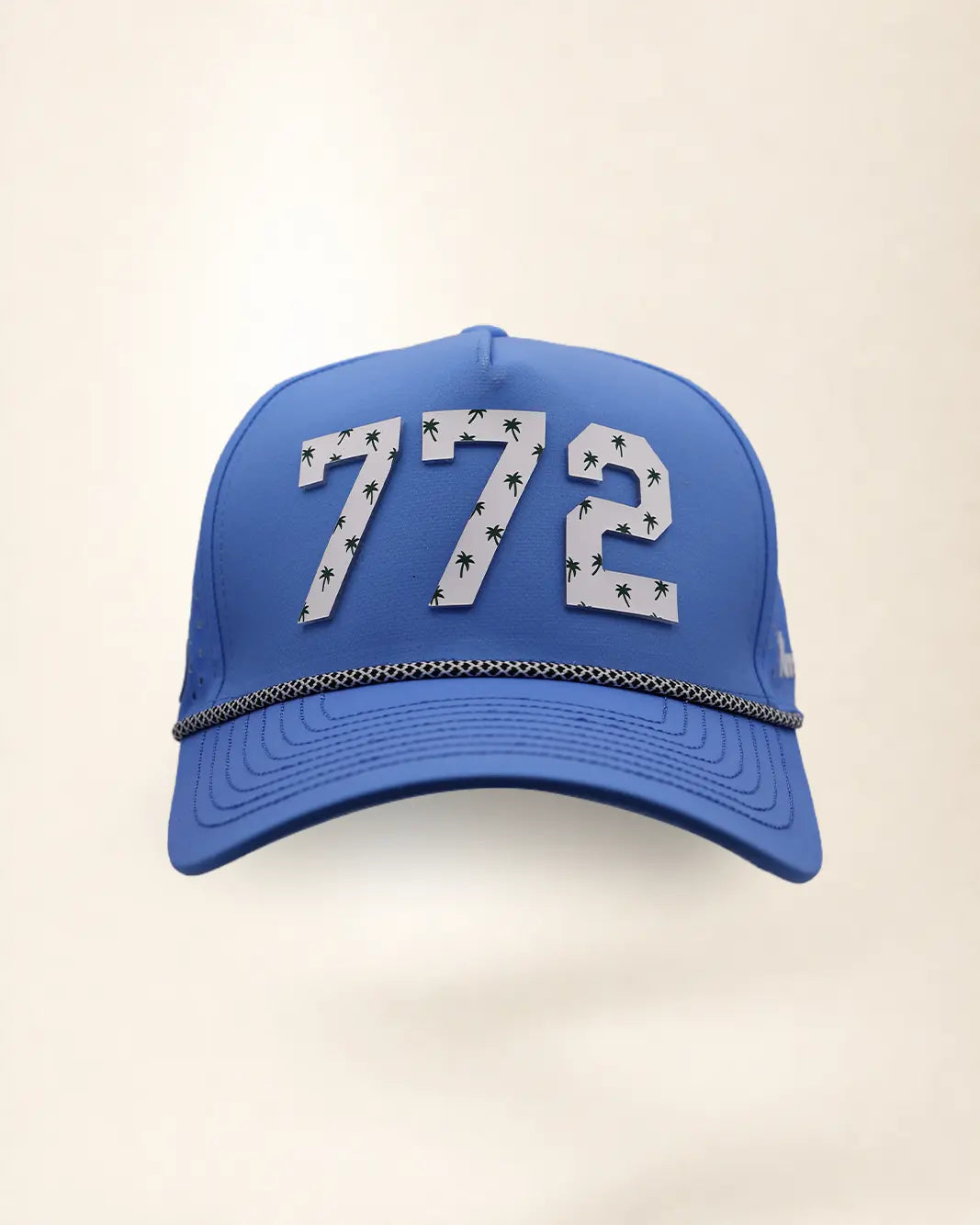 The 772 Signature Hat (Blue), front view: white raised 772 with small palm print on a blue crown, black and white rope along the brim.
