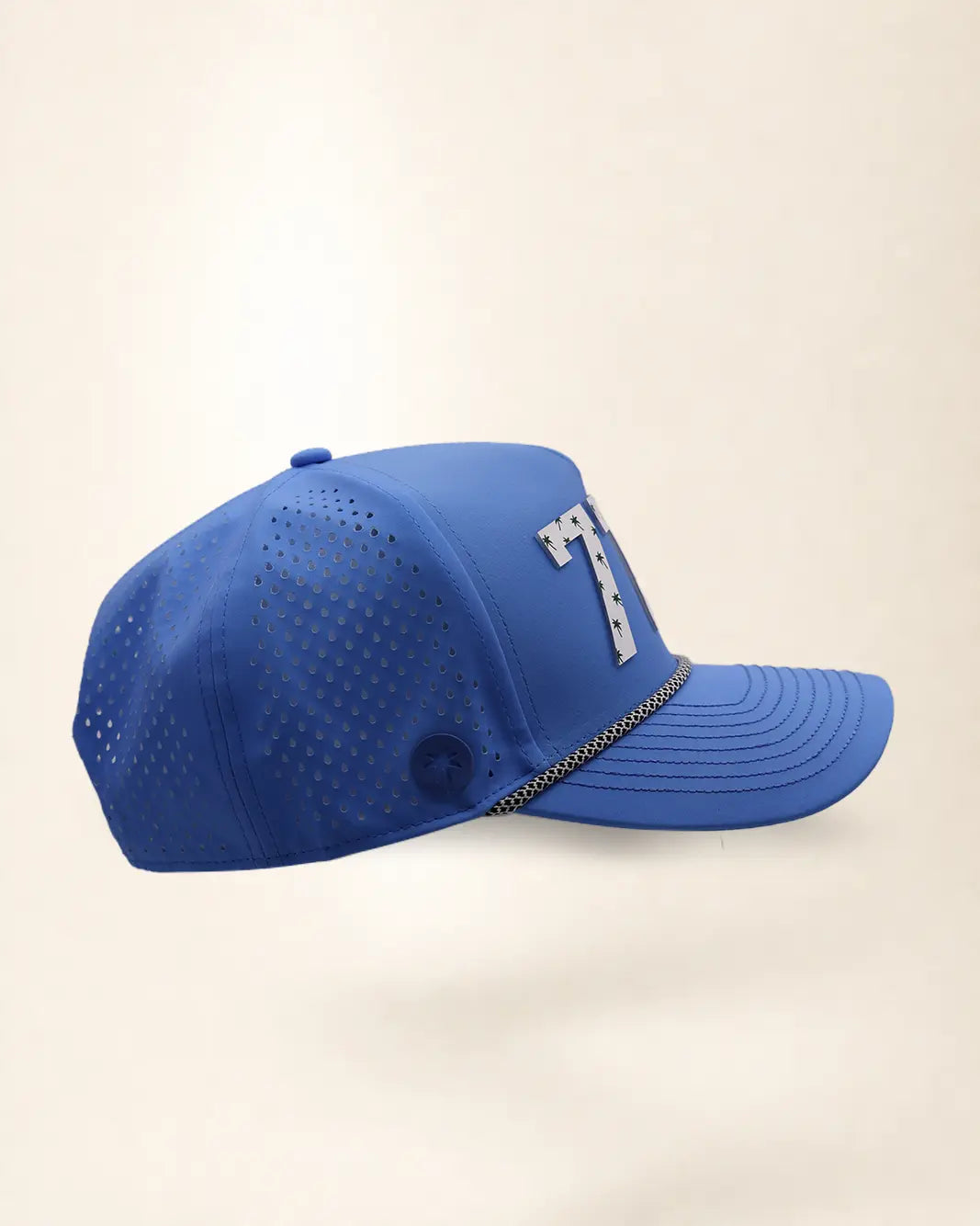 The 772 Signature Hat (Blue), right side view: perforated side panel, palm badge, black and white rope, edge of the white 772.