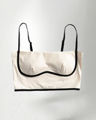 white and black strapless top on a plain background