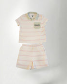 Striped children's polo shirt and shorts set with 'PALMR' branding on a white background
