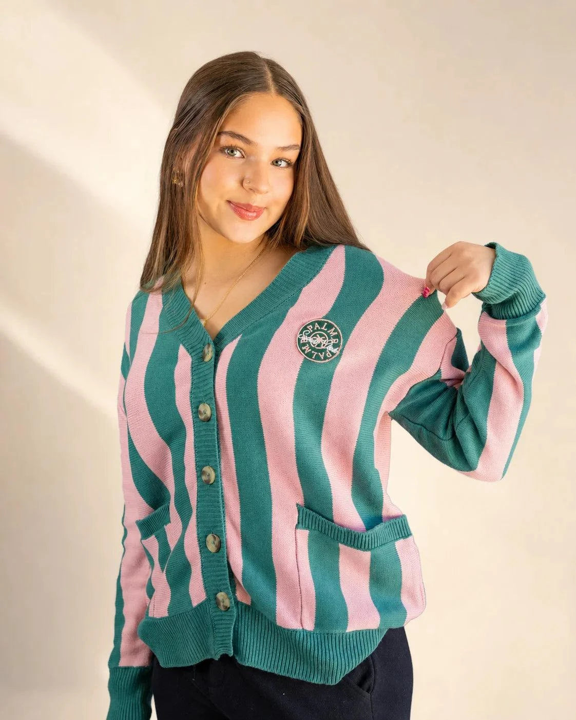 Pink and cream striped Palm of My Heart Cardigan with embroidered patch and front pockets on relaxed fit model