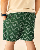 The Club Palm Hybrid Swim Shorts in Palm Green geometric diamond print with palm tree details and zippered pockets.