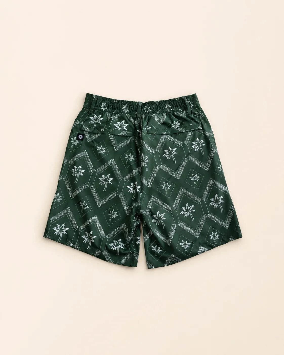 The Club Palm Hybrid Swim Shorts in Palm Green geometric diamond print with palm tree details and zippered pockets for versatile swim-to-street wear