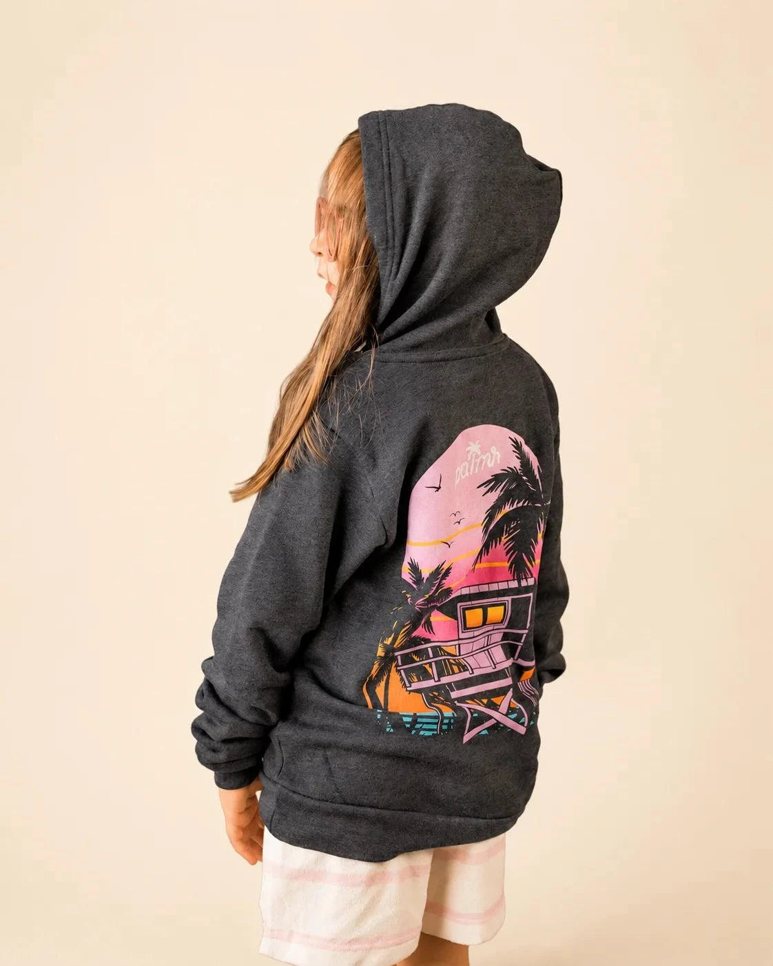 The Evening Palm Kids Hoodie in dark heather grey with sunset graphic on back and Palmr logo on front