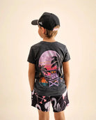 Black mineral wash Evening Palm Kids Tee with Palmr logo and beach-sunset graphic, soft lightweight cotton-poly blend