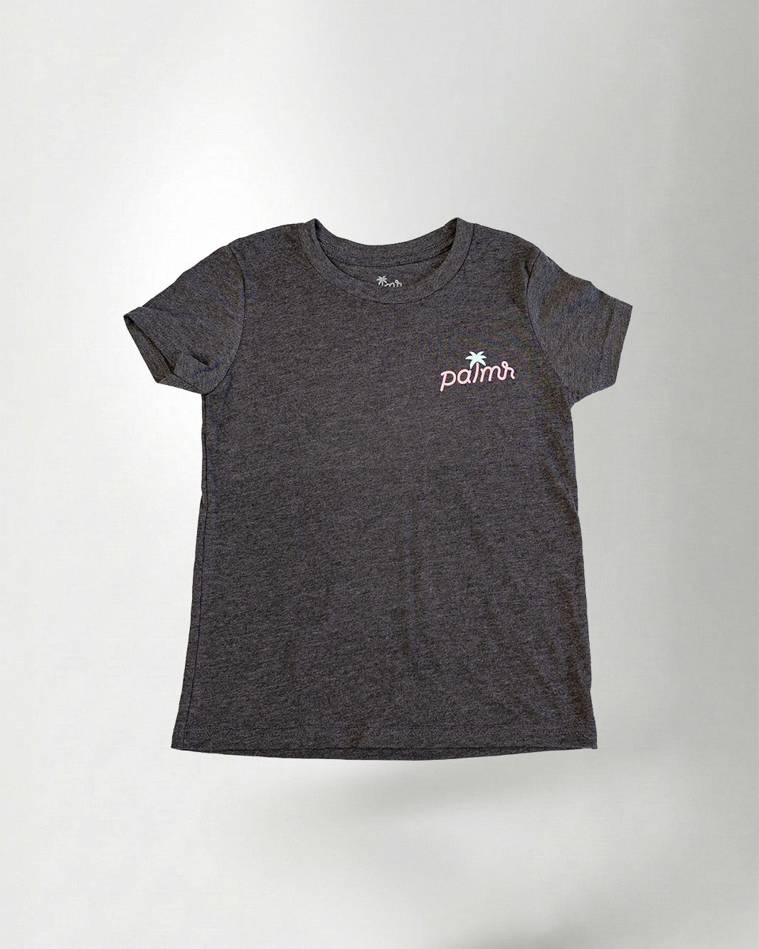 Child wearing a black t-shirt with a colorful graphic design on the back, standing against a plain background.