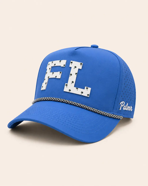 The FL Signature Hat (Blue): blue rope snapback with FL in white palm-print letters, black-and-white braided rope on the brim, perforated sides.
