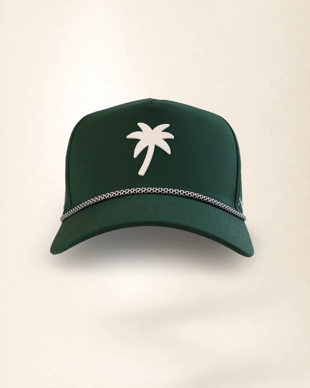 A dark green baseball cap featuring a white palm tree logo on the front and a silver chain detail along the brim, set against a plain light beige background.