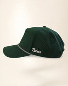 A dark green perforated baseball cap with a silver chain detail along the edge of the brim and white embroidered text reading 'Palmr' on the side, shown against a plain light beige background.