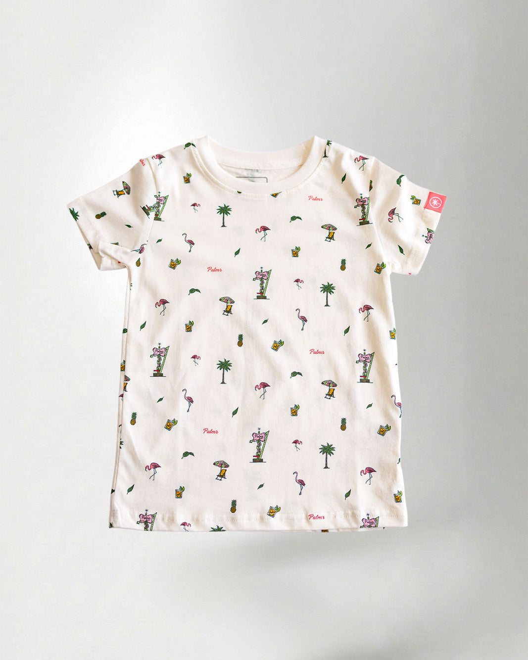 Patterned shirt and pink pants on a plain background