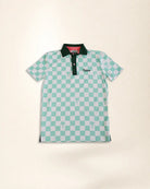 A short-sleeve polo shirt featuring a mint green and white checkered pattern with small palm tree motifs, a dark green collar, and a green embroidered 'Palmr' logo on the chest, displayed flat against a light beige background.