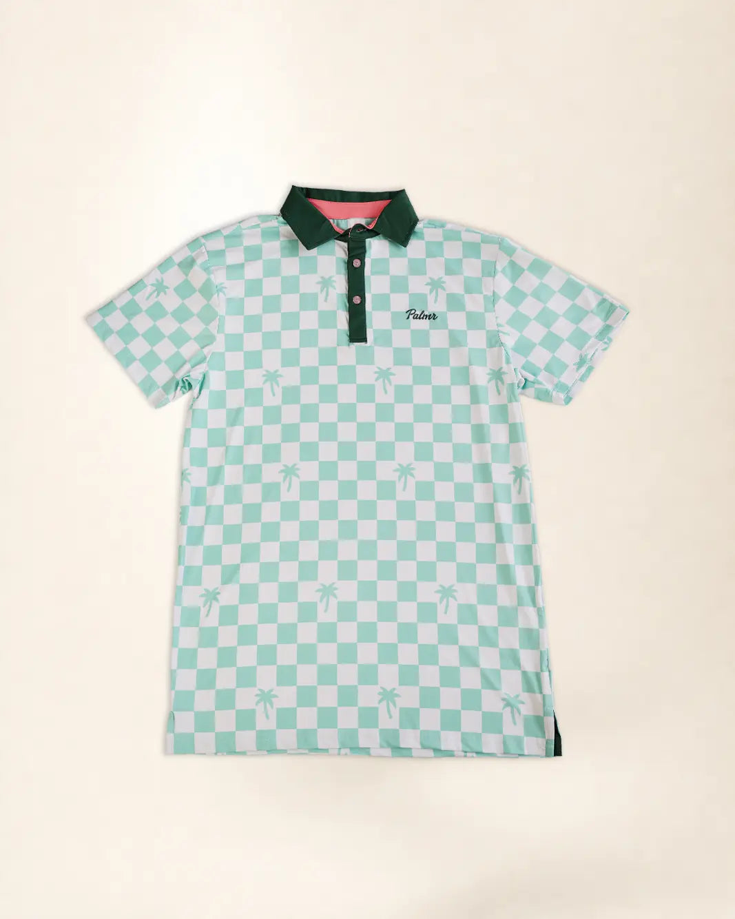 A short-sleeve polo shirt with a mint green and white checkerboard pattern, featuring a dark green collar and placket, and a small embroidered logo on the left chest.